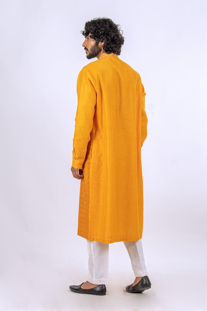 ORANGE ALLOVER MACHINE EMBROIDERY KURTA (only kurta)