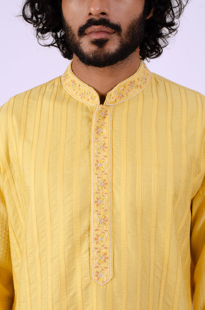 YELLOW ALLOVER PATCH LINE WITH EMBROIDERED PLACKRT KURTA (only kurta)
